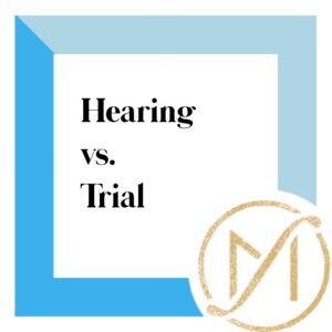 Square with blue border and while background that says hearing vs. trial in black and has the gold freed marcroft logo in the lower right corner.