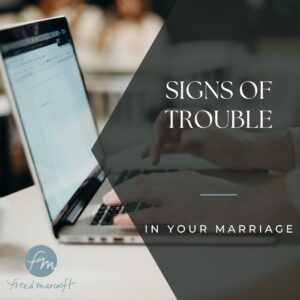 laptop in the background with the words "signs of trouble in your marriage" and the freed marcroft connecticut divorce and family law attorneys logo