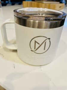 Picture of coffee in a Yeti mug with the Freed Marcroft divorce lawyers logo